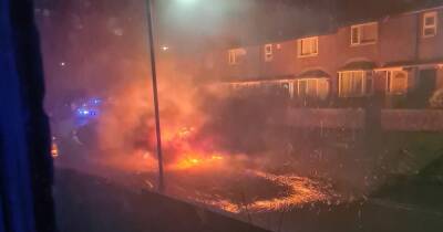Dramatic picture shows the moment car is engulfed in flames on street - www.manchestereveningnews.co.uk