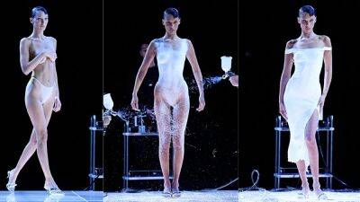 Bella Hadid - David Beckham - Yolanda Hadid - Bella Hadid struts runway topless, then gets white dress spray-painted for Paris Fashion Week - foxnews.com - Paris - Italy - city Milan, Italy