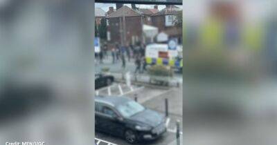 Police arrest 11 men after violence erupts in mass brawl between football hooligans - www.manchestereveningnews.co.uk - Manchester