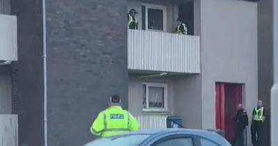 Police swoop on block of Scots flats as man taken to hospital after ‘assault’ - dailyrecord.co.uk - Scotland