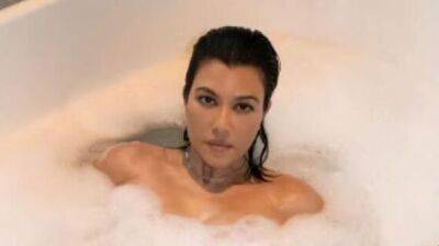 Travis Barker Just Shared Multiple Bathtub Pics of Kourtney Kardashian's ‘Angel Feet’ - www.glamour.com