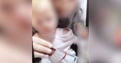 Woman appears to 'give baby a vodka shot' in appalling video - www.manchestereveningnews.co.uk - Manchester