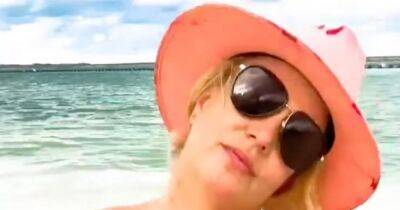Britney Spears fans shocked as she films full nude video with tourists in background - www.ok.co.uk