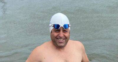 Dad rushed to hospital after swimming for 22 hours straight in freezing waters - www.dailyrecord.co.uk
