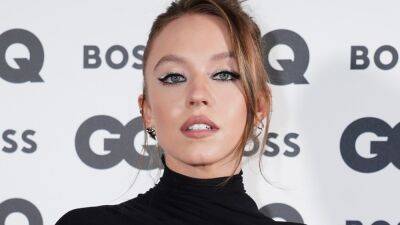 Gigi Hadid - Joe Alwyn - Tom Hiddleston - Sydney Sweeney Looked Positively Bionic in a Black Gown With a Silver Breastplate—See Pics - glamour.com - Britain