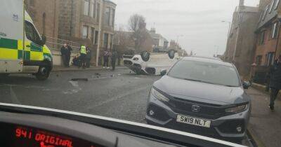 Van flips on roof after crash on Scots road as driver rushed to hospital - dailyrecord.co.uk - Scotland