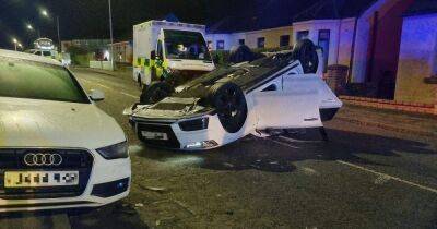 Car flips on roof in Scots town horror smash as driver hospitalised and arrested - www.dailyrecord.co.uk - Scotland