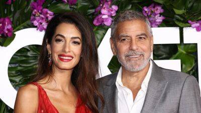 George Clooney Helped Amal Clooney With Her Dress on the Red Carpet - www.glamour.com - Kentucky - Washington - Washington, area District Of Columbia - Columbia