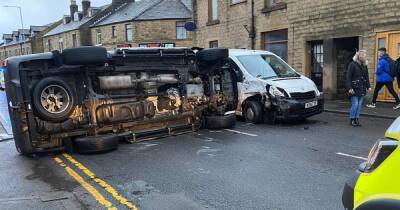 Two taken to hospital after car overturns in road - www.manchestereveningnews.co.uk - Manchester