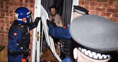 'You're famous': Shirtless man's door smashed down as cops storm homes and make dozens of arrests - www.manchestereveningnews.co.uk - county Hall - Manchester