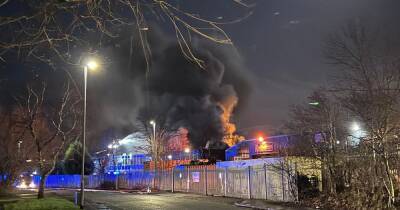 Huge fire at industrial estate sends smoke billowing into air following reports of 'explosion' - www.manchestereveningnews.co.uk - Manchester