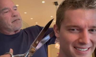 Arnold Schwarzenegger gives Patrick a Terminator approved haircut using large shears - us.hola.com