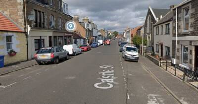 Teen arrested as cops race to scene of alleged armed robbery in Scots town - www.dailyrecord.co.uk - Scotland