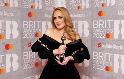 Adele says “not many people” make “personal” albums anymore at BRITs 2022 - www.nme.com