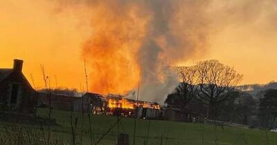 Dramatic pictures show barn engulfed in flames amid ongoing incident in quiet Scots village - www.dailyrecord.co.uk - Scotland