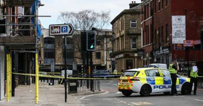 Two men arrested as 24-year-old remains in hospital after stabbing in town centre - www.manchestereveningnews.co.uk - Manchester - city Bury