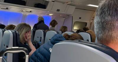 Manchester Airport hit by chaos AGAIN as passengers stuck in 'sweatbox' plane amid huge delays - www.manchestereveningnews.co.uk - Italy - Manchester