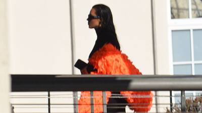 Kim Kardashian Jets Out Of Paris In Orange Feather Boa Black Skirt After Balenciaga Show - hollywoodlife.com - Paris - New York - California