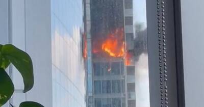 Fire crews battle huge blaze at London flats as glass panels seen crashing to ground - www.dailyrecord.co.uk - London