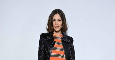Alexa Chung flashes her legs in black miniskirt and orange striped top - www.msn.com - France - Italy - Ukraine - Portugal