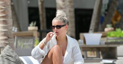 Molly-Mae Hague covers up in shirt as she lounges poolside in Mexico - www.ok.co.uk - Mexico - Hague