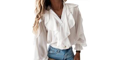 This Button-Down Blouse Is Decked Out With Romantic Ruffles - www.usmagazine.com