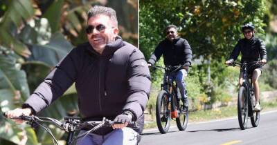 Simon Cowell - Lauren Silverman - Simon Cowell all smiles on bike ride with fiancée after removing fillers from face - msn.com - Britain - Miami - California