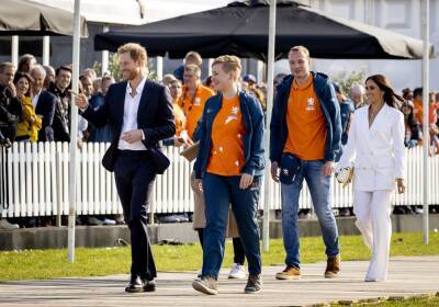 Meghan Markle Stuns In White Suit As She Joins Prince Harry At First Event Of The Invictus Games - etcanada.com - Ukraine - Netherlands - city Hague, Netherlands