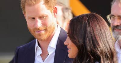 Prince Harry appears more in love than ever as he looks adoringly at Meghan Markle - www.ok.co.uk - Ukraine - Netherlands - Hague