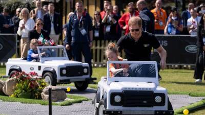 Drive time: Harry and Meghan ride in miniature Land Rovers - abcnews.go.com - Ukraine - Russia - Netherlands - city Hague, Netherlands