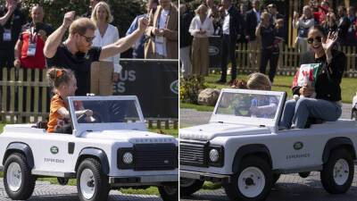 Prince Harry and Meghan Markle all smiles while riding miniature Land Rovers at Invictus Games event - www.foxnews.com - Britain - Netherlands - Hague