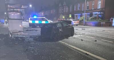 Driver flees after ploughing car into the front of three homes on busy road - www.manchestereveningnews.co.uk