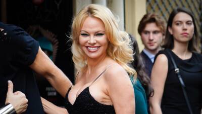 Pamela Anderson - Tommy Lee - Pamela Anderson’s Sheer Red Wrap Dress Is a Timeless Take on the See-Through Trend - glamour.com - New York - Chicago