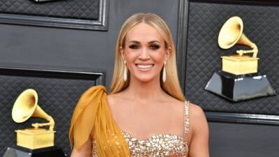 Carrie Underwood and Her Golden GRAMMYs Gown Catch Husband Mike Fisher's Eye - www.etonline.com - Las Vegas