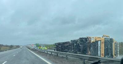 Lorry overturns and halts traffic on Scots motorway as driver makes lucky escape - www.dailyrecord.co.uk - Scotland
