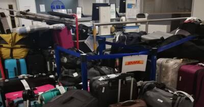 Pictures show hundreds of 'abandoned' suitcases piled up in Manchester Airport baggage hall - www.manchestereveningnews.co.uk - Manchester - Switzerland
