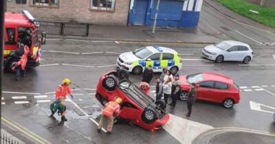 Woman left trapped after car flips onto roof outside pub - www.manchestereveningnews.co.uk - Manchester - county Oldham
