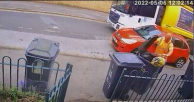 Bin man caught on CCTV throwing rubbish out of bin and onto street - www.dailyrecord.co.uk - Scotland
