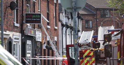 Fire service issue update after two people rescued during Ashton takeaway blaze - www.manchestereveningnews.co.uk - Manchester