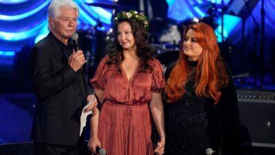 Ashley Judd - Wynonna Judd - Naomi Judd - Larry Strickland - Naomi Judd's Husband Larry Strickland Speaks Out for First Time at Late Wife's Tribute - etonline.com - city Vienna