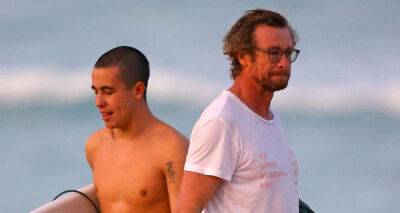 Wears Prada - Simon Baker Goes for Dip in the Ocean While at the Beach with Son Harry - justjared.com - Australia - county Ocean