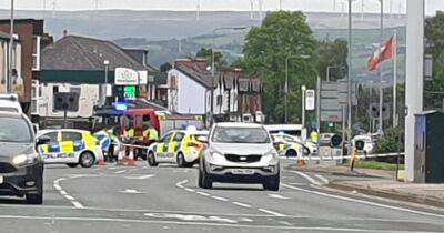 Person rushed to hospital after motorbike and car crash on busy road - www.manchestereveningnews.co.uk - Manchester
