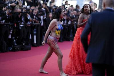 Activist Removed From Cannes Red Carpet Following Naked Protest Against Sexual Violence In Ukraine - deadline.com - France - Ukraine