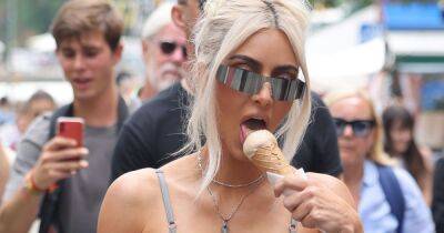 Kim Kardashian - Kourtney Kardashian - Travis Barker - Kim Kardashian West - Kim Kardashian tucks into ice cream during stroll in Italy hours before Kourtney wedding - ok.co.uk - Italy - Las Vegas - county Brown