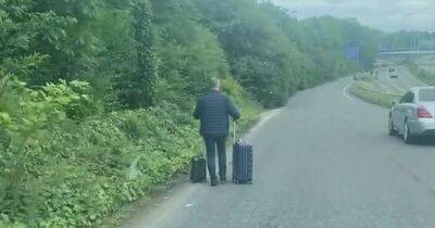 Video captures man WALKING down the A555 with suitcases near Manchester Airport - www.manchestereveningnews.co.uk - Manchester