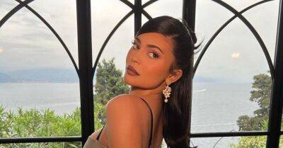 Kylie Jenner - Kourtney Kardashian - Travis Barker - Kylie Jenner stuns in silver fitted gown as she celebrates Kourtney's wedding in Italy - ok.co.uk - Italy - county Brown