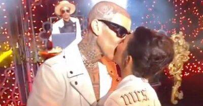 Kourtney Kardashian and Travis Barker kiss in matching Mr and Mrs jackets for first dance - www.ok.co.uk - Italy - Washington