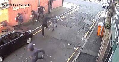 Horrifying moment gunman opens fire yards from children in gangland shooting - www.manchestereveningnews.co.uk - Manchester