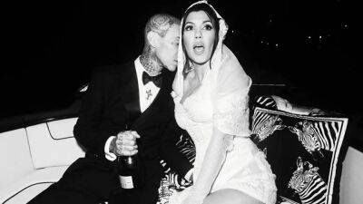 Kourtney Kardashian - Travis Barker - Travis Barker Showers Kourtney Kardashian With PDA in New Wedding Photos - etonline.com