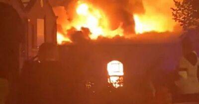 Huge fire tears through warehouse in dramatic footage as flames and smoke seen for miles - www.manchestereveningnews.co.uk - Manchester - county Oldham